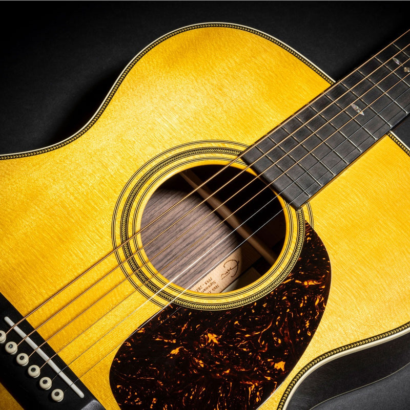 Martin 000-EC 30th Anniversary soundhole, herringbone trim, pickguard, and snowflake fingerboard inlays